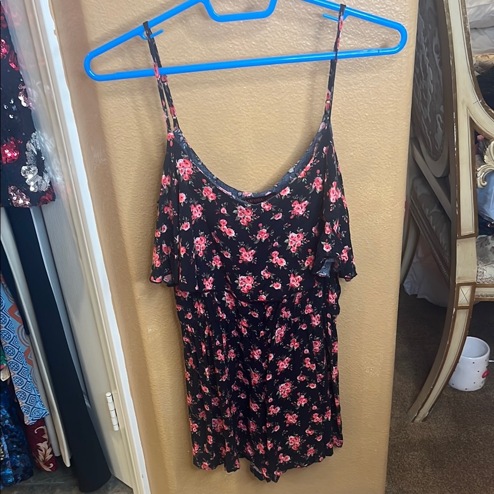 Material Girl black floral romper with ruffled bust